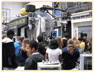 Bubble Group of students gathered around the Harbor Branch Oceanographic Institute submersible, likely on a tour or educational visit.